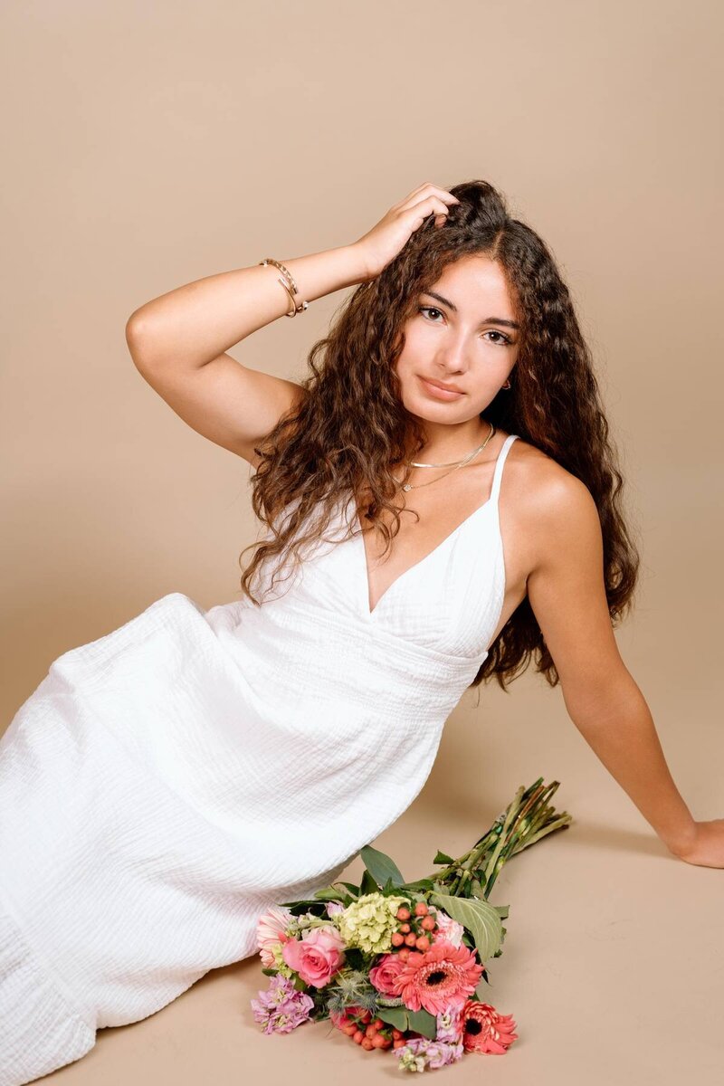 College senior portrait taken on campus, celebrating academic achievements and future goals