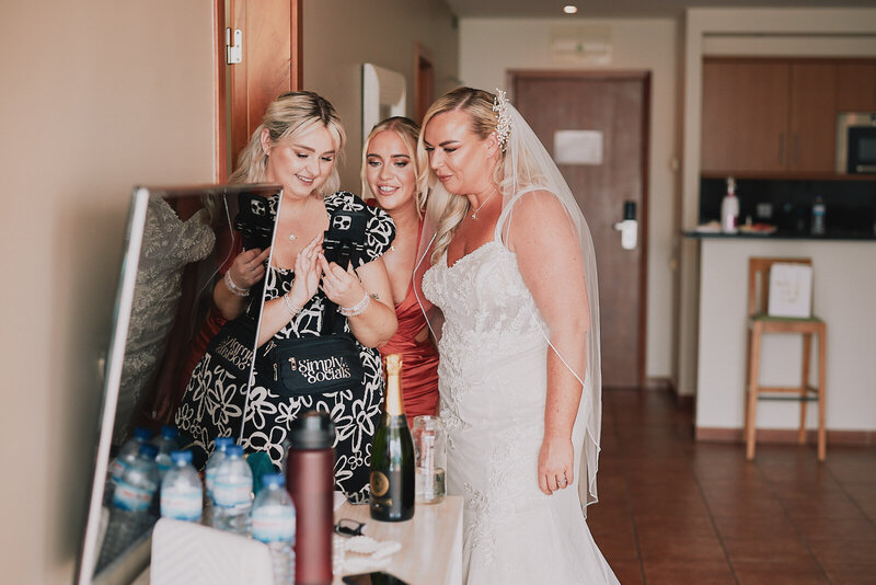 Image on a phone of a brides makeup