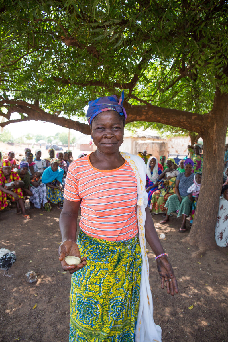 Woman with shea butter - farming meeting March 2018