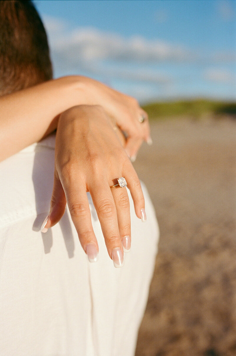 couple holding hands during lifestyle photo session in pei