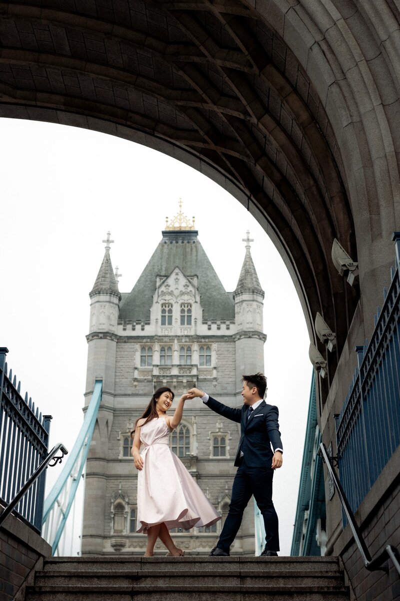 A-romantic-couple-posing-for-London-elopement-photographer-at-iconic-tower-bridge-7880