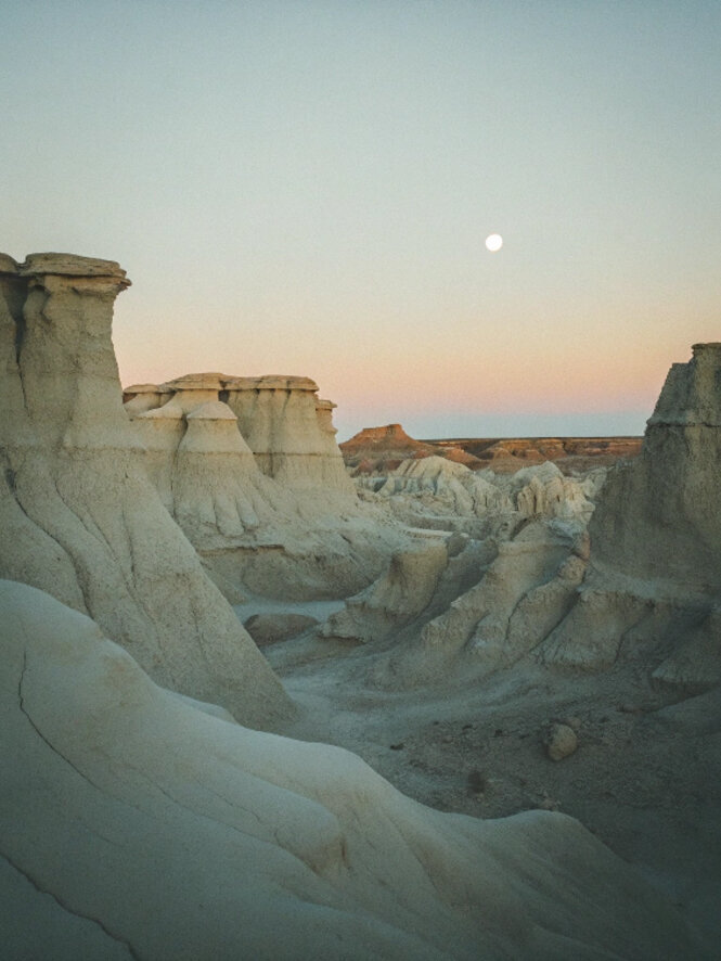 Desert rock formations at sunset under soft sky, symbolizing inner healing, transformation, and emotional exploration in The Healing Journal blog by Jessie Withers, trauma and EMDR Parts therapist in California