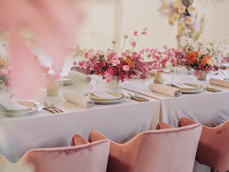 pink velvet chairs and pink flowers of. variety