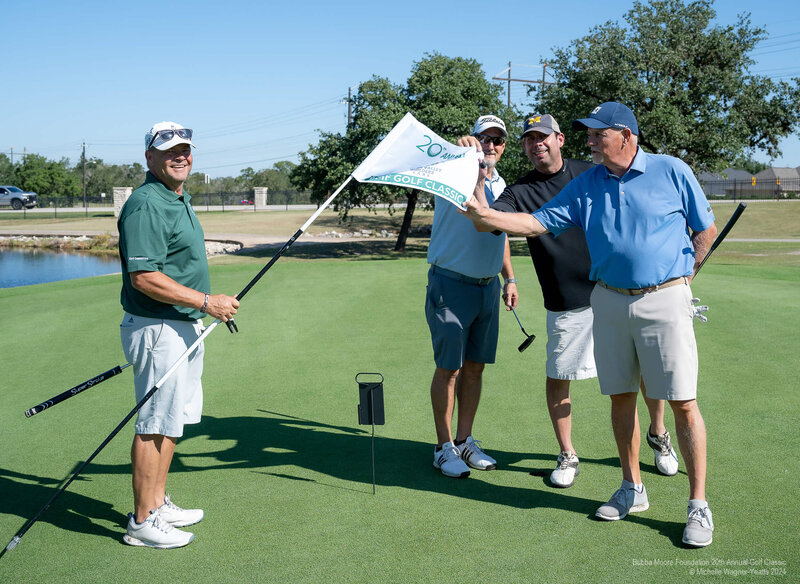 Golfers at charity golf fundraiser hosted by Bubba Moore Foundation in Bryan Texas