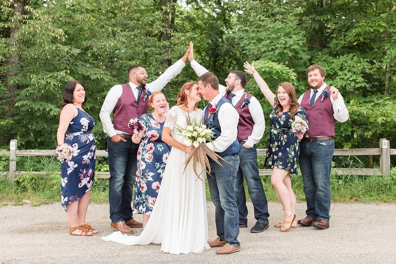Bride and Groom sharing their first kiss during outdoor wedding