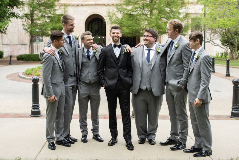 Groom and groomsmen laughing Century Room downtown Asheville, NC wedding