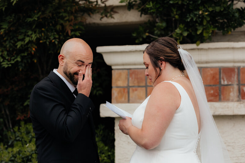 Groom wipes away tears as the bride reads her vows at the Arizona grand resort