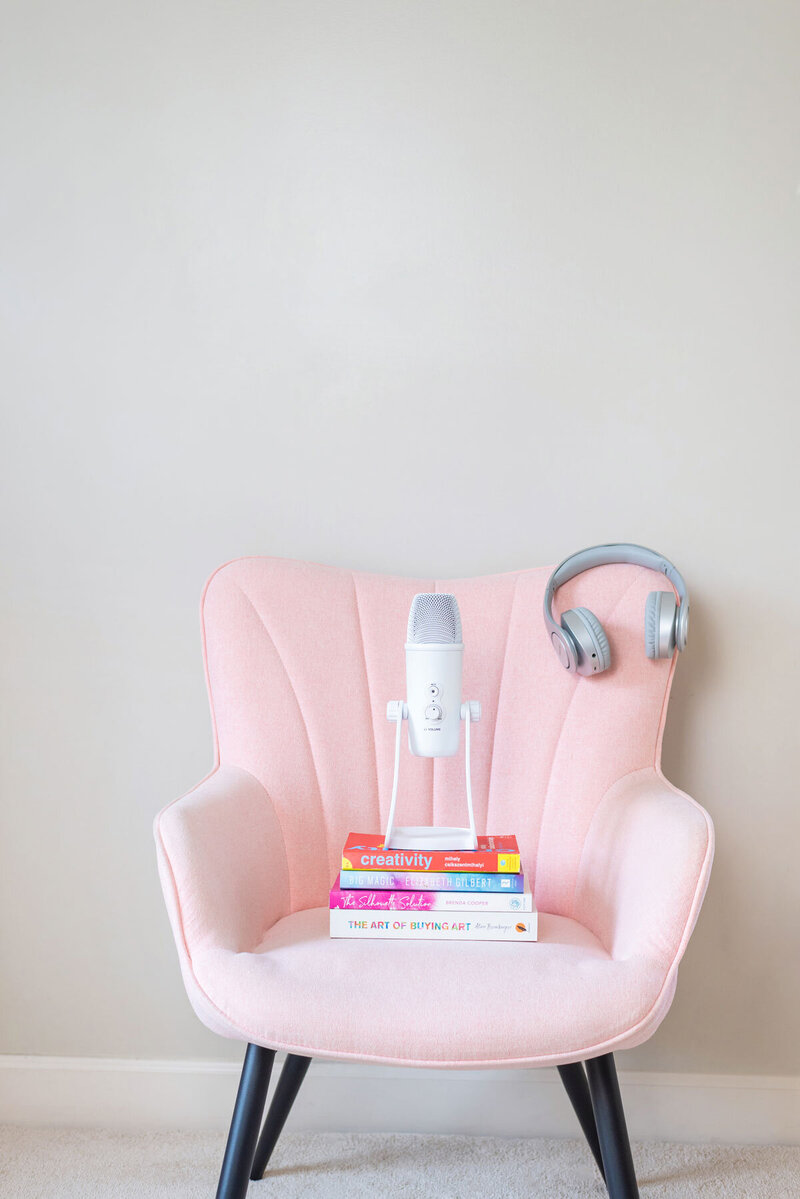Pink chair with podcast mic and headphones