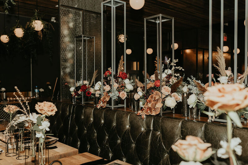 Wedding reception setup with floral arrangements at restaurant