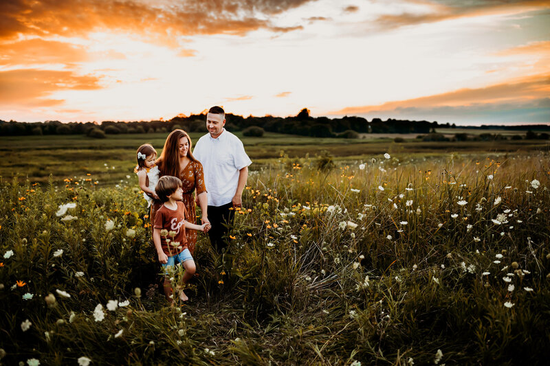 Family with twins during a spring maternity session located in the heart of Madison, WI with a beautiful sunset.