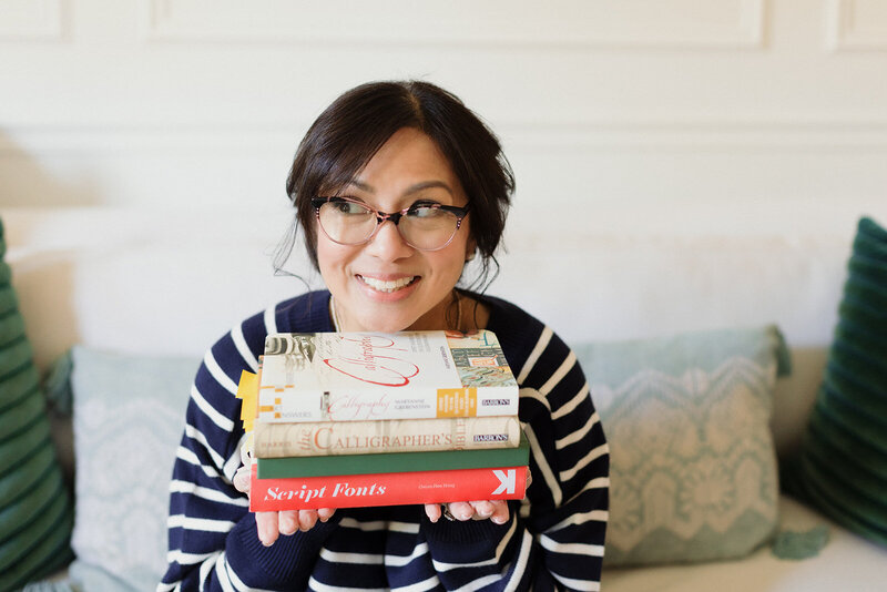 Person Holding Stack of Books