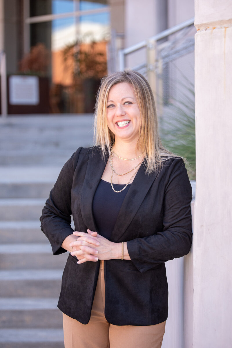 Attorney Erin K. Urquhart of McDow & Urquhart LLC standing outside the Rock Hill, SC courthouse, smiling in a professional portrait.