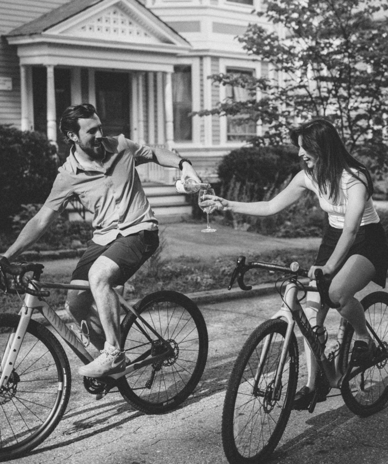 A couple riding bikes - engagement photos by Victoria Costello