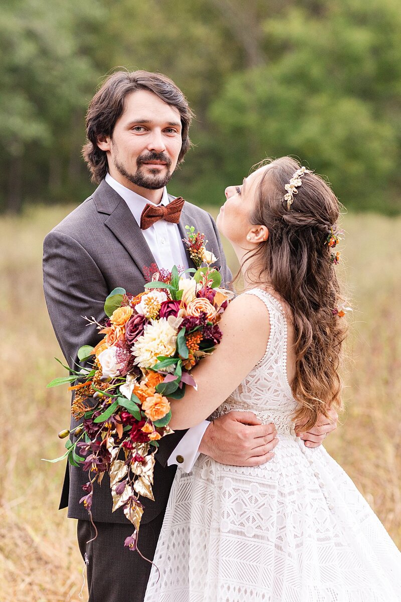 Bride and groom standing in a field at Avonlea Farms in Richmond, Virginia.