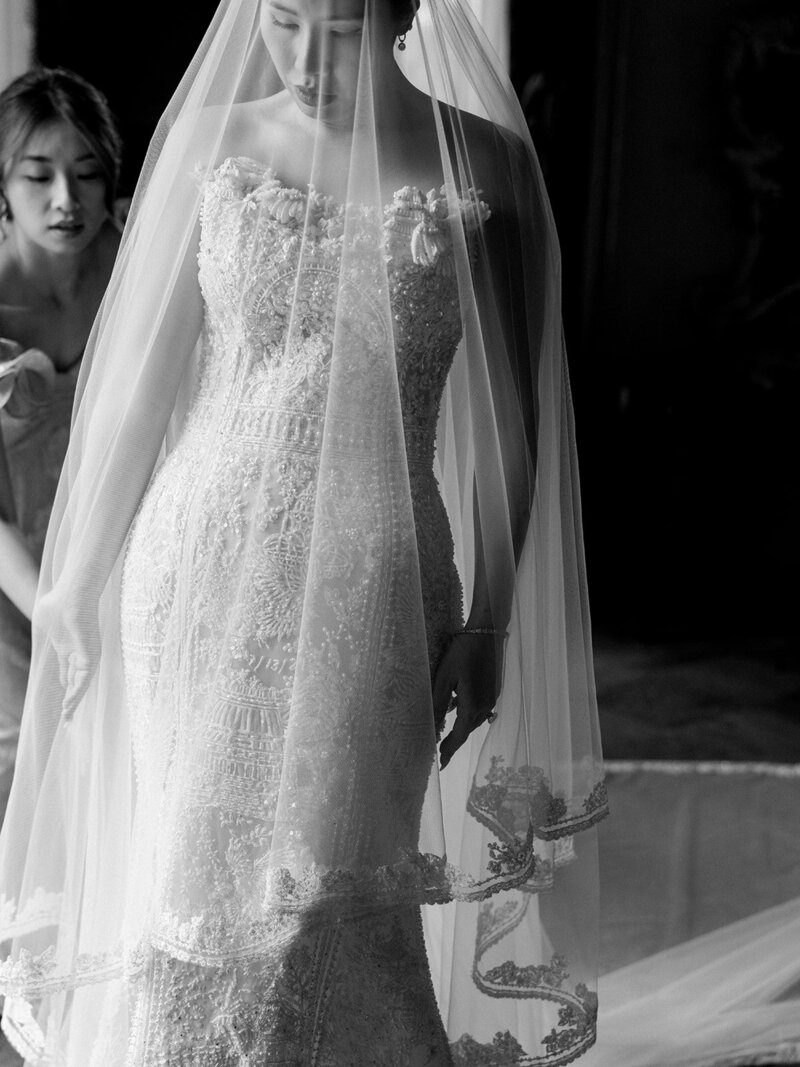 Bride in Monique Lhuillier walks with her father down the aisle at her wedding in Ravello at Villa la Rondinaia