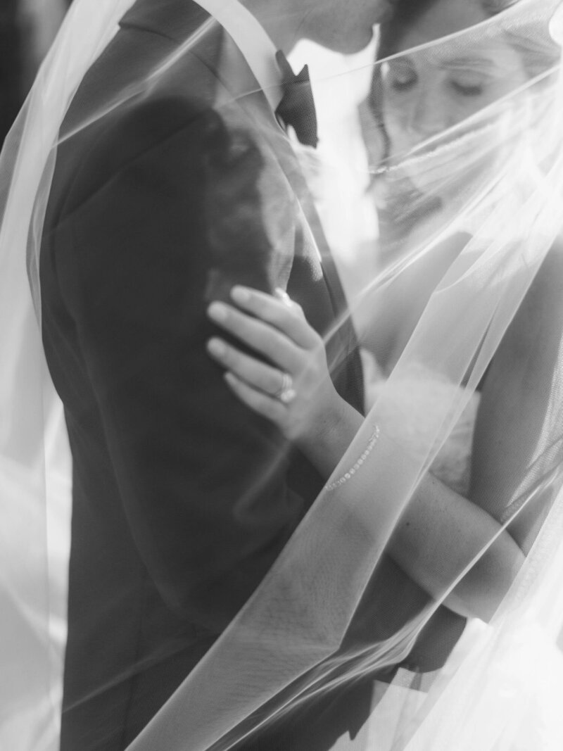  Bridal portrait during an Ombroneta wedding in Tuscany, with couple wrapped in veil