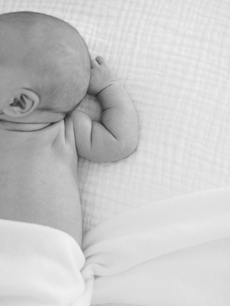 A close-up of a baby's back and arm at a newborn photography session in Richmond by Katie Stansfield Photography.