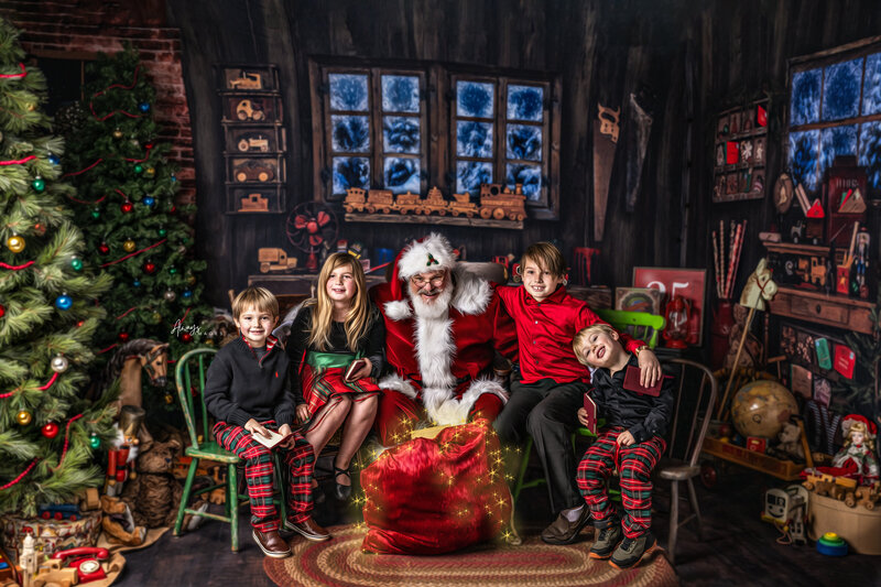 South Bend Indiana Santa and Girl with Christmas Ornaments and magical sparkles at Always Images Photography Studio in Plymouth, Indiana.
