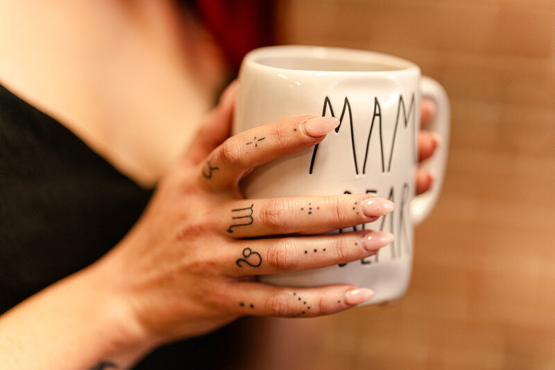 Spiritual Mama holding her cacao mug