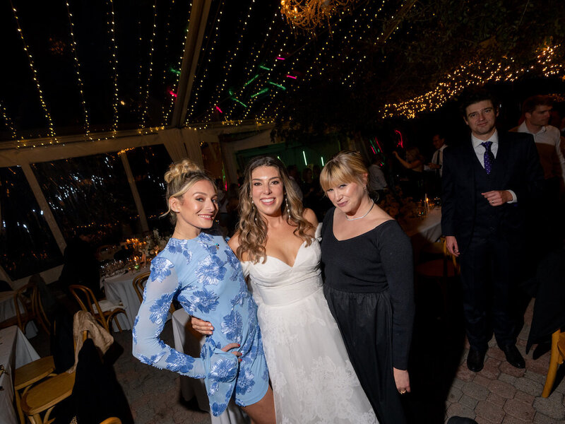 Evening wedding reception under string lights in The Allan House courtyard