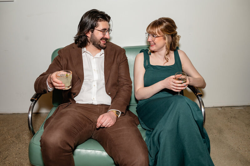 Wedding guests sit during cocktail hour at Greenhouse Loft in Chicago