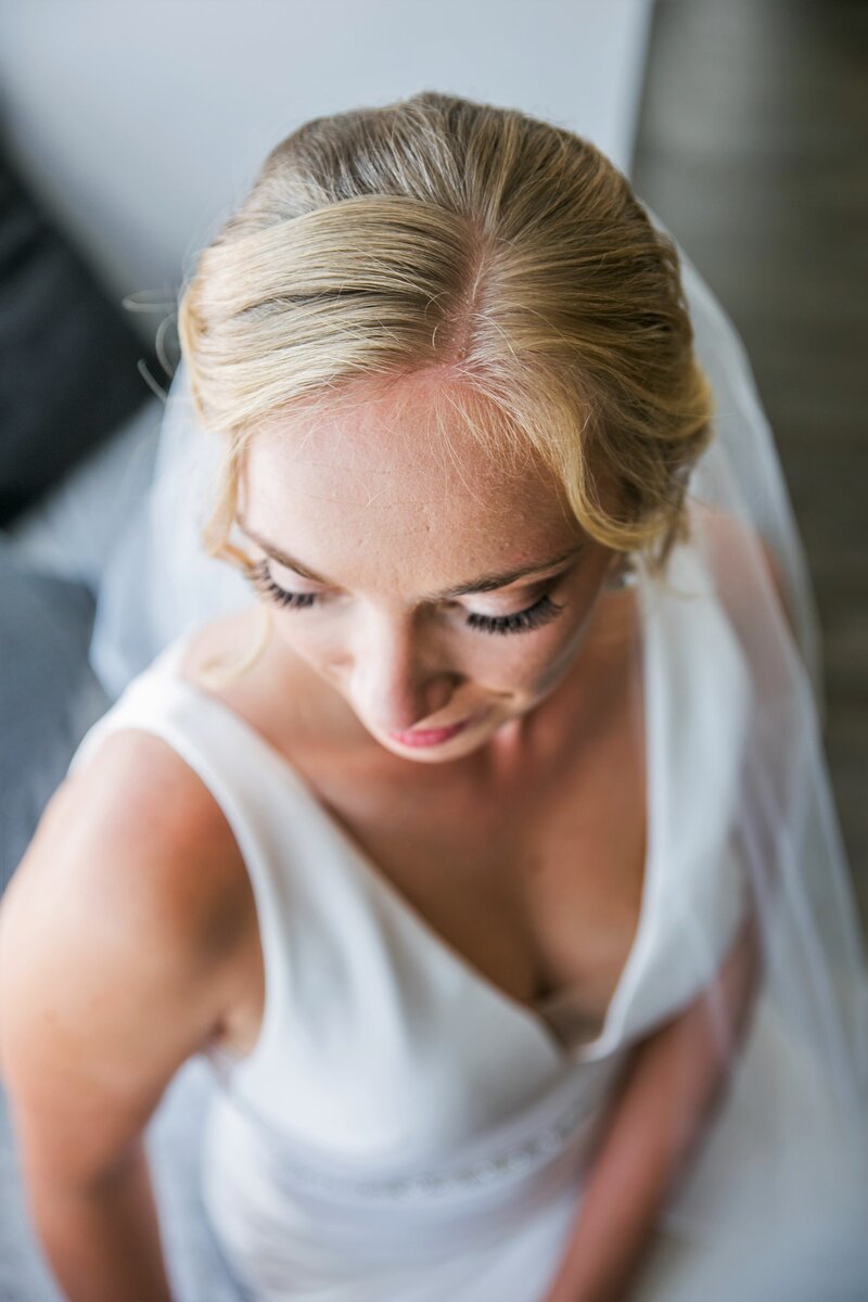 Bride wearing veil looking down to show makeup | Klein Wedding at Grace on the Lake