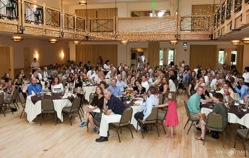 Wedding guests seated at their dinner tables inside the Silverthorne Pavilion in Colorado