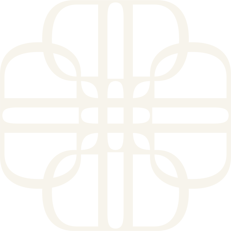 Studio Petita brand mark, a minimalist design with intertwining curved lines forming a symmetrical flower-like shape in cream