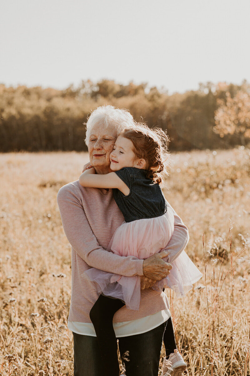 young girl hugging her grandma 