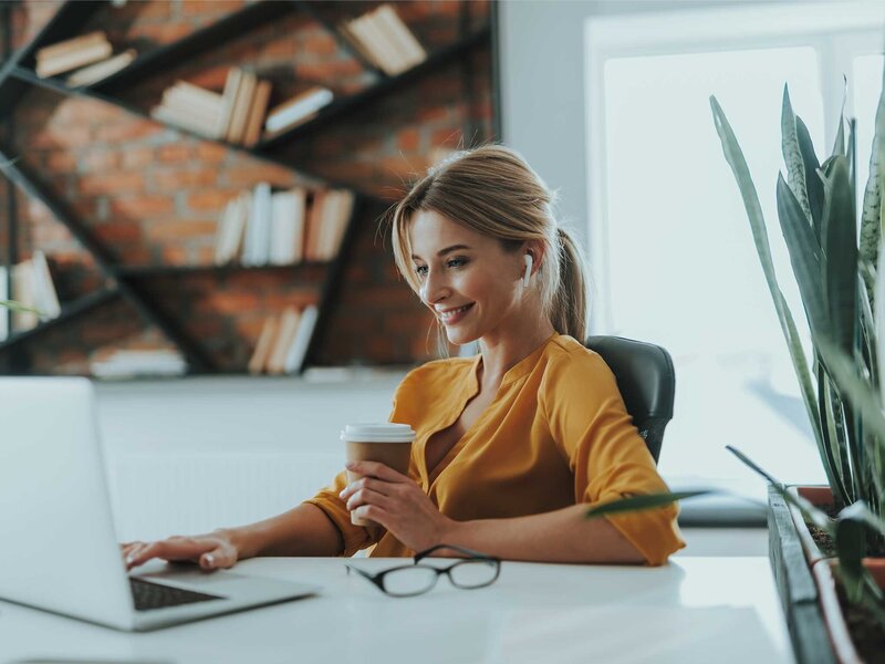 business woman reviewing Loyel Media ad copy