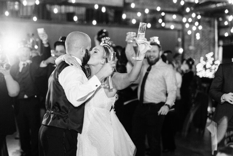 bride and groom laughing during wedding toast at reception by winx photo tennessee wedding photographer
