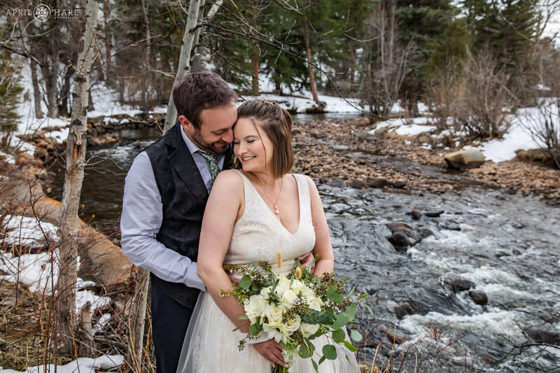 Sweet Wedding Photo by the River at Romantic Riversong Inn Estes Park CO