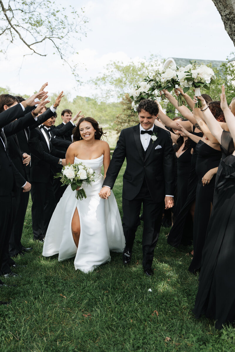 WEdding couples walking together laughing Morais Vineyard Virginia