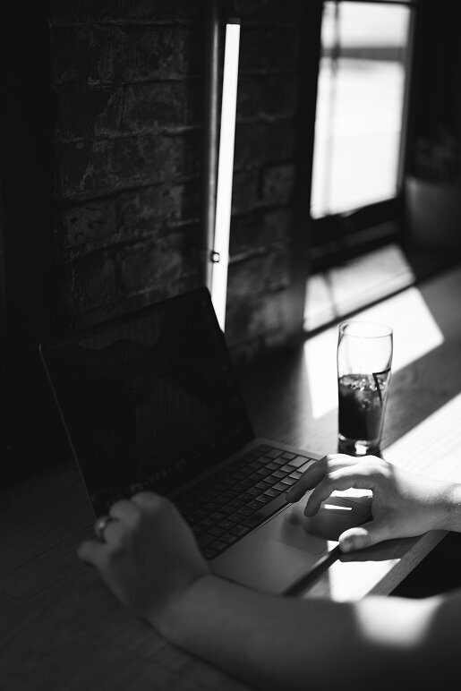 a laptop and a drink