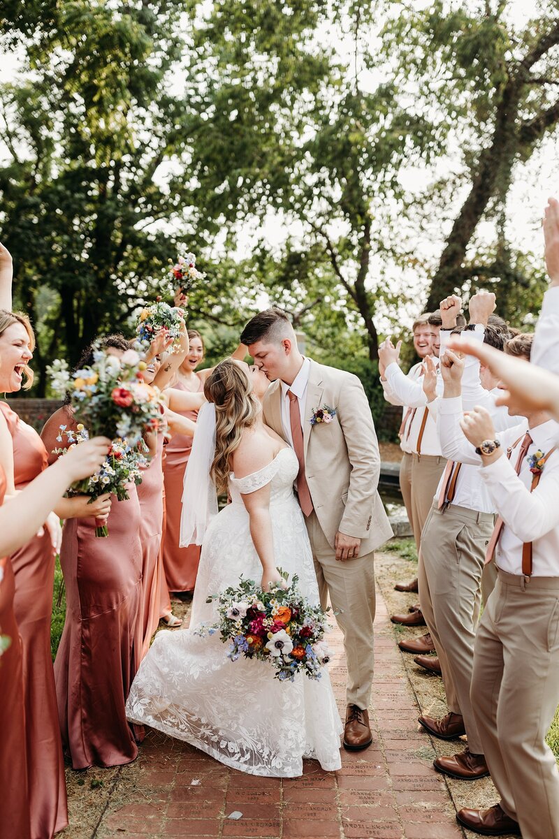Louisville Kentucky wedding photographer captures joyful wedding party celebration at Gardencourt.
