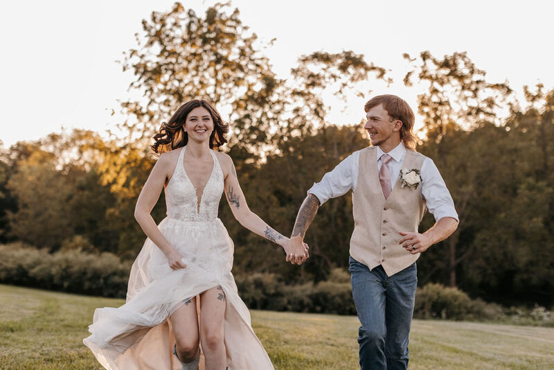 bride and groom running at a new jersey wedding. Photographed by Blooming Faith Photography