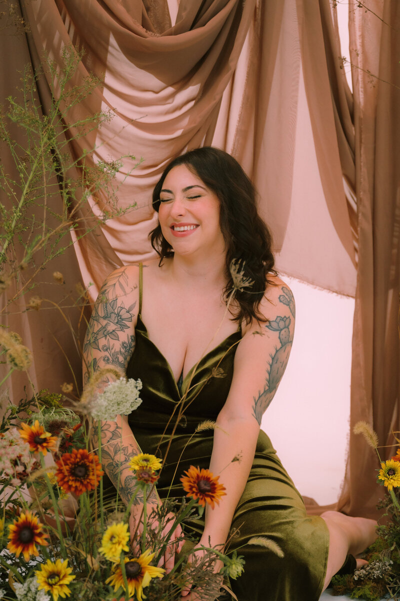 Colleen smiles with flowers