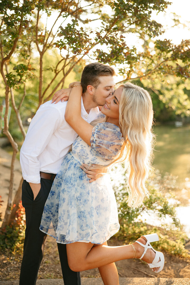 Man kissing woman on the cheek during Nashville engagement session