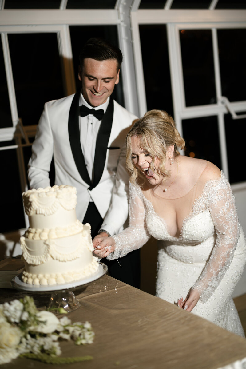 bride in groom at upscale bar with bride on grooms lap with a drink