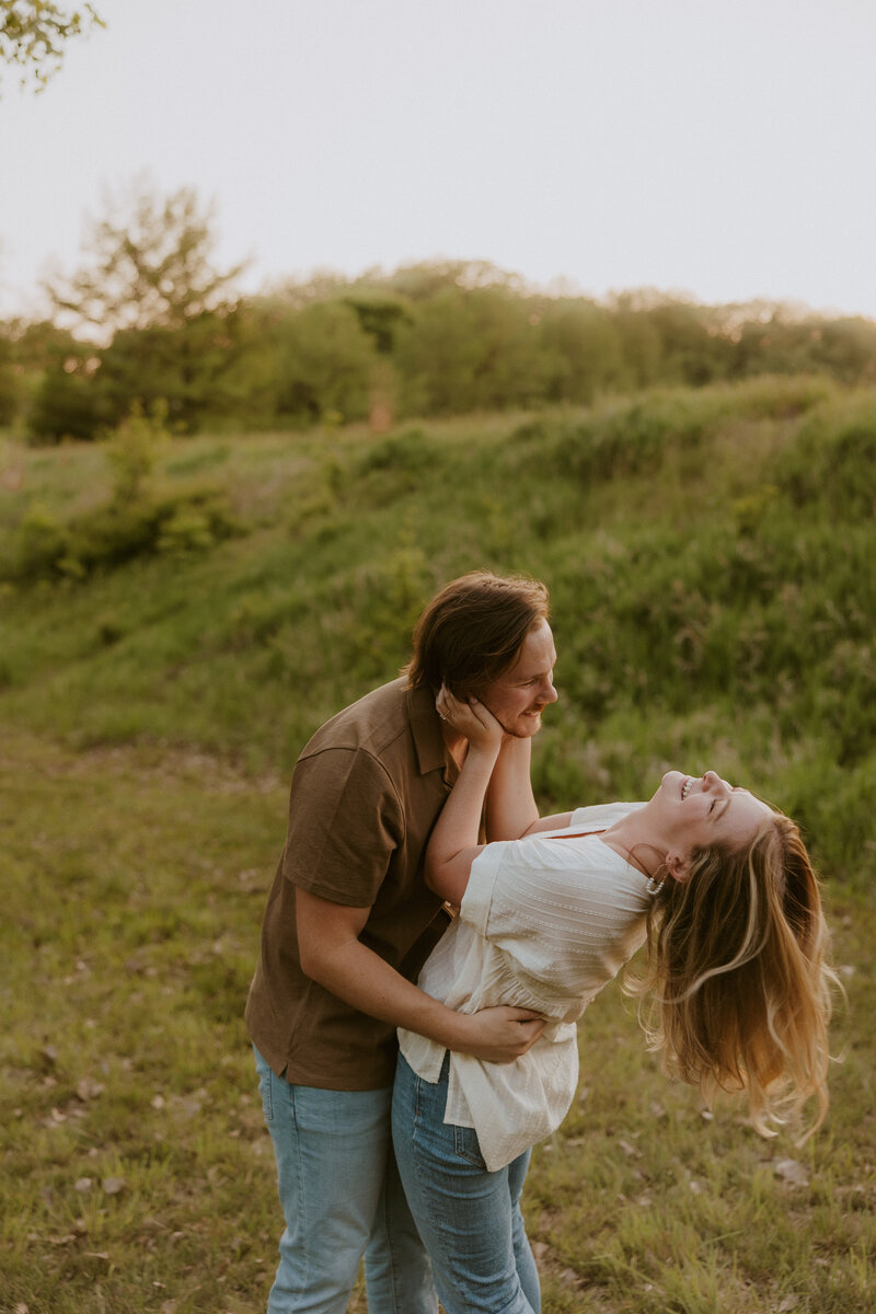 outdoor couples photoshoot with fun couple in field