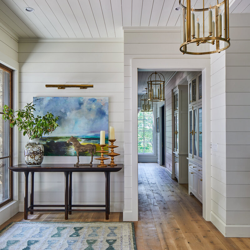 Bright entry way with paneling
