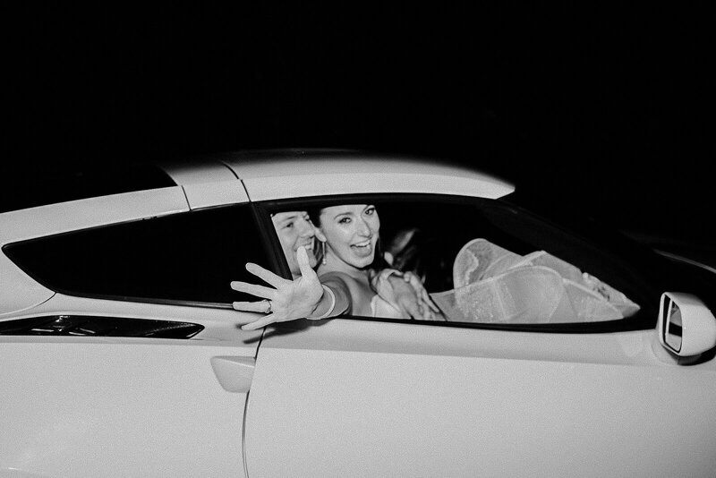 bride and groom exit in corvette