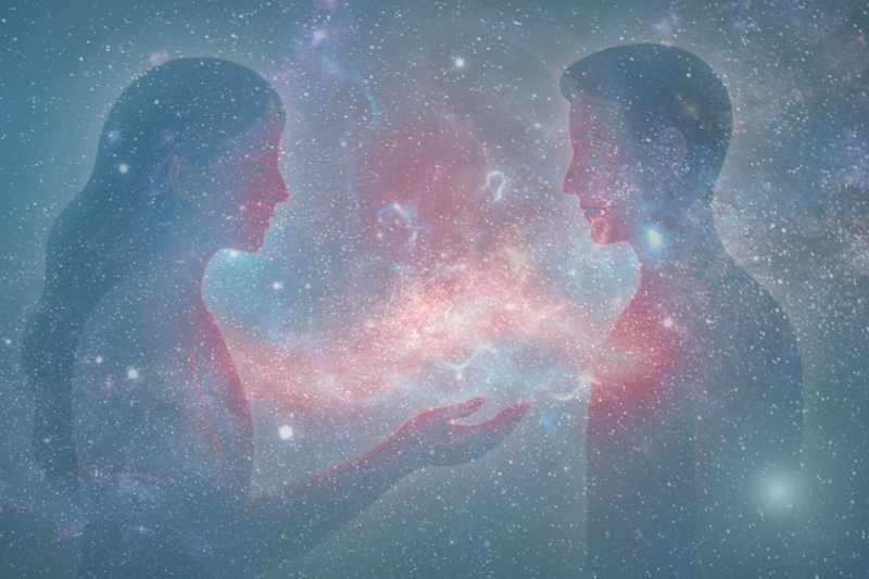 A colorfully dressed Reiki Master has their hands on a clients forehead and shoulder to deliver energy healing. 