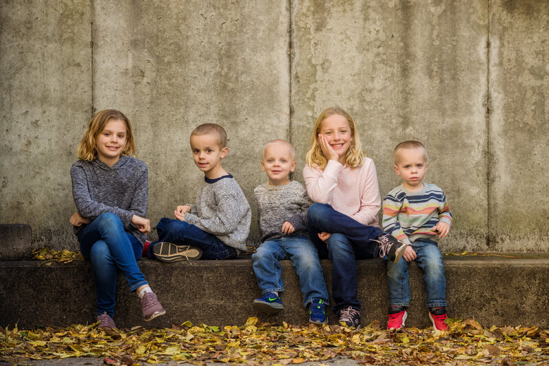 A group of five energetic kids showing their personalities and laughter during a Phoenixville mini session.