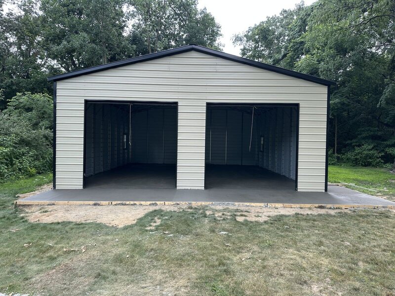 Two-door metal garage with a new concrete floor and apron in Elkhart, IN