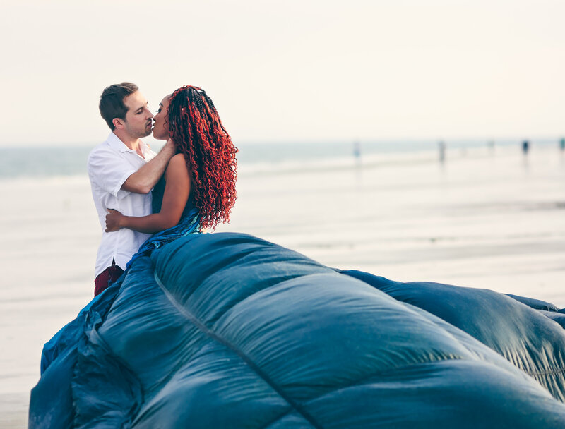 Savannah Georgia Boudoir and Glamour couple with woman in blue parachute gown on beach