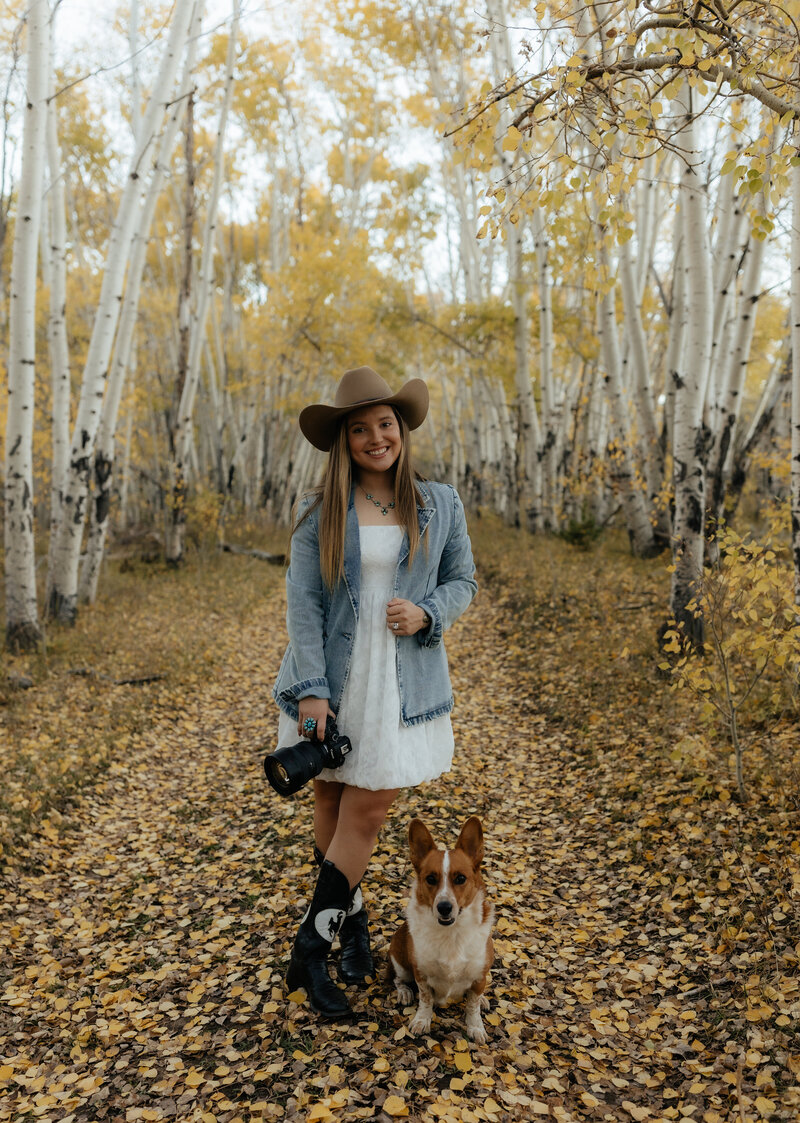 Studio portrait of a Wyoming-based wedding and lifestyle photographer, captured in a clean and professional setup with soft lighting and a relaxed pose.