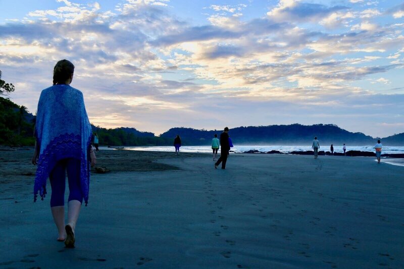 Students in walking meditation practice in Playa Negra during yoga instructor course in Costa Rica