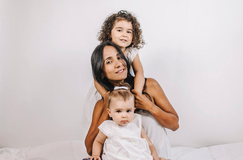Amazing photo of mom and her two daughter in studio