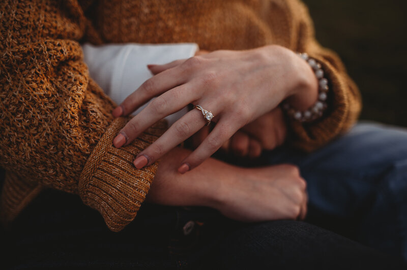 Close of woman's hand with engagement ring